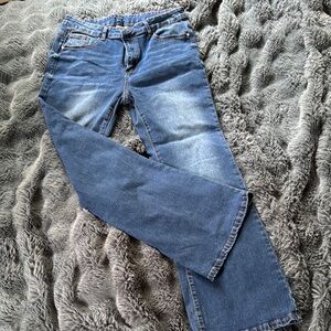 Blue Boot Cut Jeans with Distressed Detailing